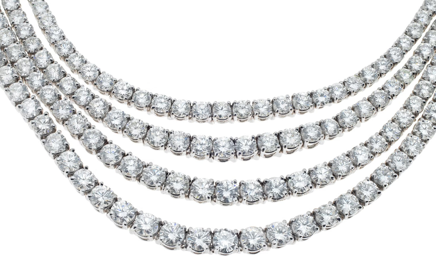 Four strand draping diamond necklace and dangling earring set in 18k white gold