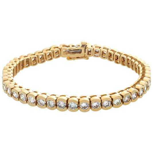 Diamond tennis bracelet in 14k yellow gold with over 7 carats in round diamonds